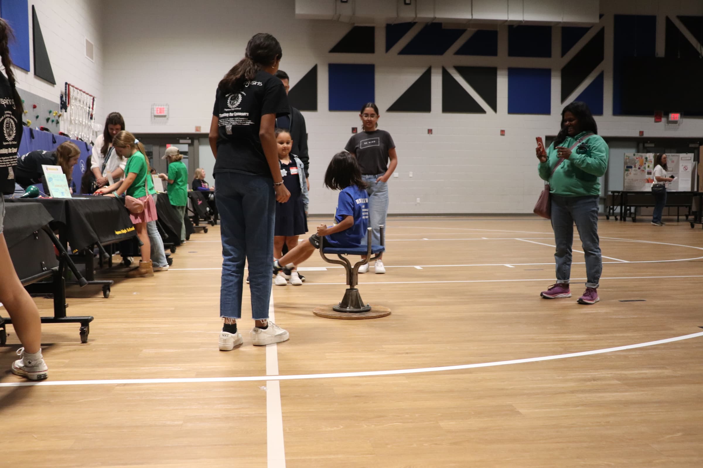 Young girl spinning on a chair created by the SiS team